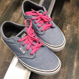 Denim blue vans with contrasting pink laces.